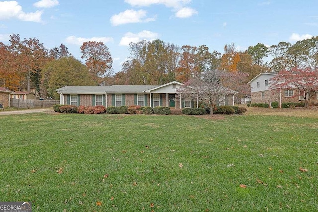 single story home featuring a front yard