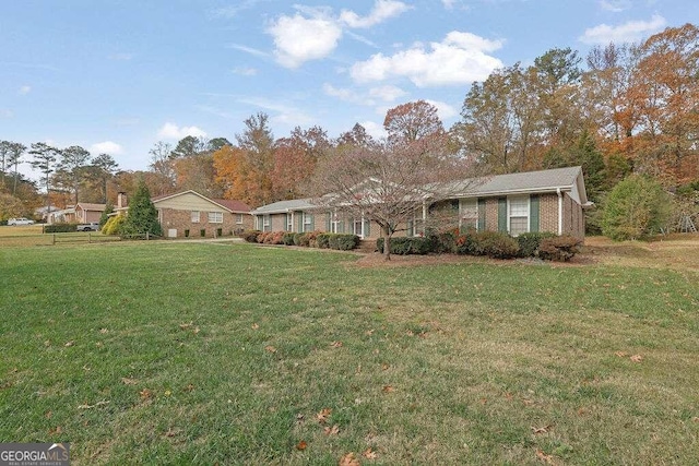 single story home featuring a front yard