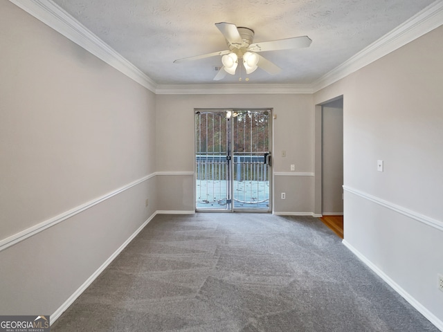 carpeted spare room featuring a textured ceiling, ceiling fan, and ornamental molding