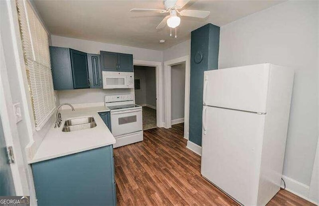 kitchen featuring blue cabinetry, dark hardwood / wood-style flooring, sink, and white appliances