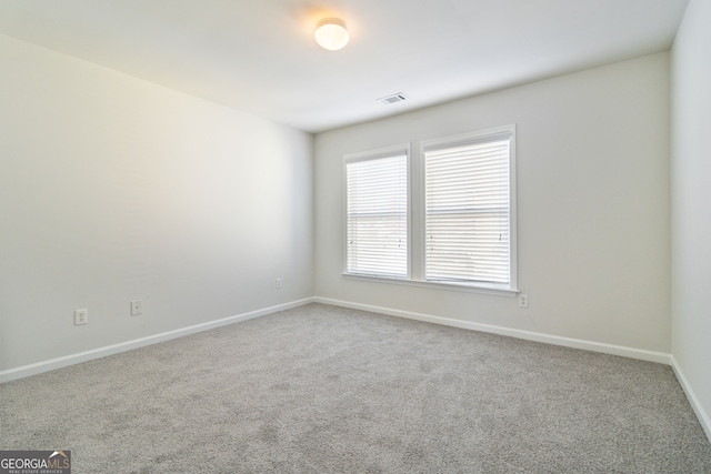 unfurnished room with carpet floors