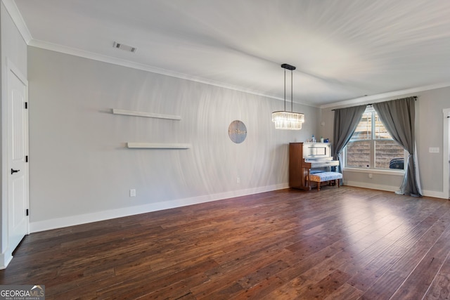 interior space featuring dark hardwood / wood-style floors and ornamental molding