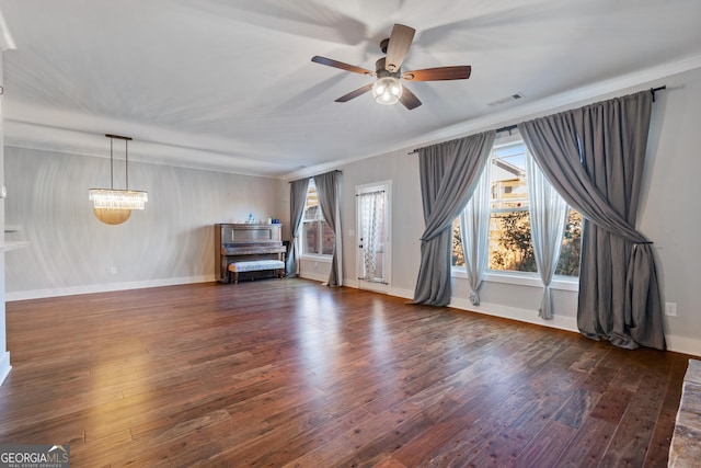 interior space with ceiling fan and dark hardwood / wood-style floors