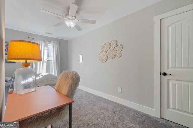 office area with ceiling fan and carpet floors