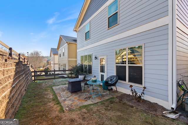 rear view of house featuring a patio