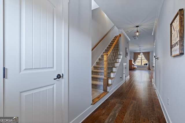 corridor with dark hardwood / wood-style flooring