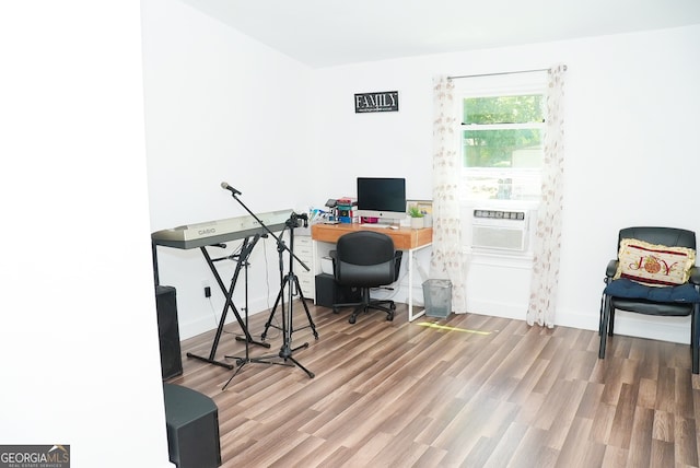 office with hardwood / wood-style flooring and cooling unit