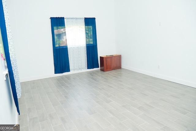 unfurnished room featuring light hardwood / wood-style flooring