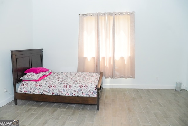 bedroom with light hardwood / wood-style flooring