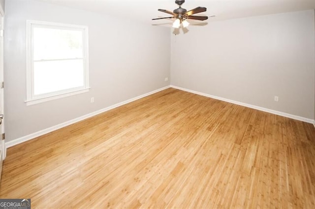 unfurnished room featuring ceiling fan and light hardwood / wood-style floors