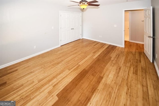 unfurnished bedroom featuring ceiling fan and light wood-type flooring