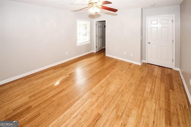 unfurnished room featuring ceiling fan and light wood-type flooring