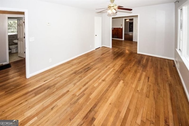 empty room featuring ceiling fan and hardwood / wood-style flooring