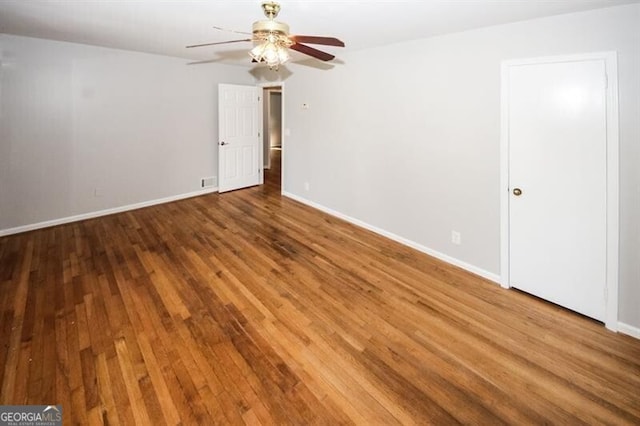 empty room with wood-type flooring