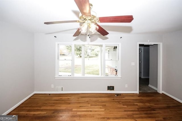 empty room featuring dark hardwood / wood-style floors