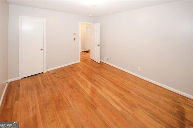 spare room featuring light wood-type flooring