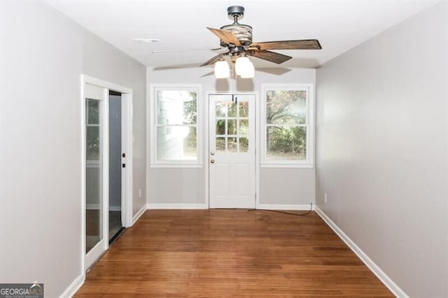 doorway to outside with ceiling fan and hardwood / wood-style floors