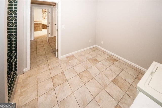 empty room with light tile patterned floors