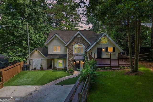 view of front of house featuring a yard and a deck