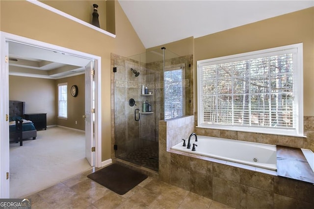 bathroom featuring tile patterned flooring, separate shower and tub, plenty of natural light, and lofted ceiling