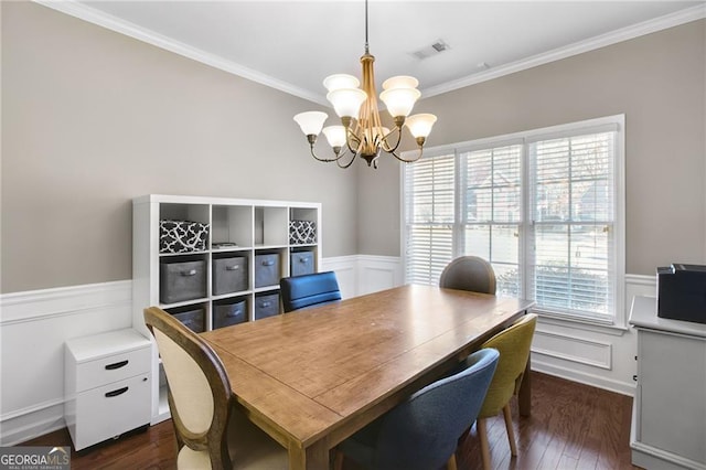 dining room featuring crown molding, plenty of natural light, dark wood-type flooring, and a notable chandelier