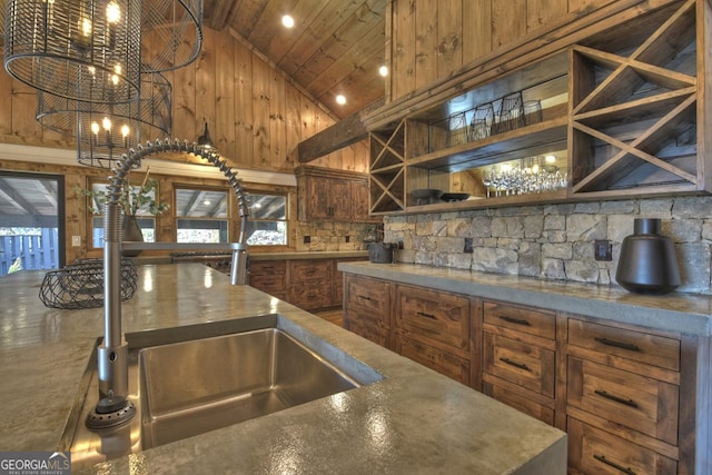 kitchen featuring beam ceiling, sink, high vaulted ceiling, and wooden ceiling