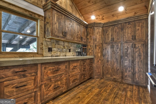 bar with wooden ceiling, dark wood-type flooring, wooden walls, vaulted ceiling, and dark brown cabinetry