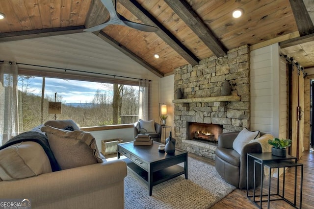 living room featuring a stone fireplace, ceiling fan, wooden ceiling, and hardwood / wood-style flooring