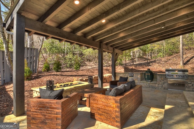 view of patio / terrace featuring outdoor lounge area, an outdoor kitchen, and a grill