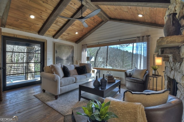 living room with vaulted ceiling with beams, hardwood / wood-style flooring, ceiling fan, and wooden ceiling