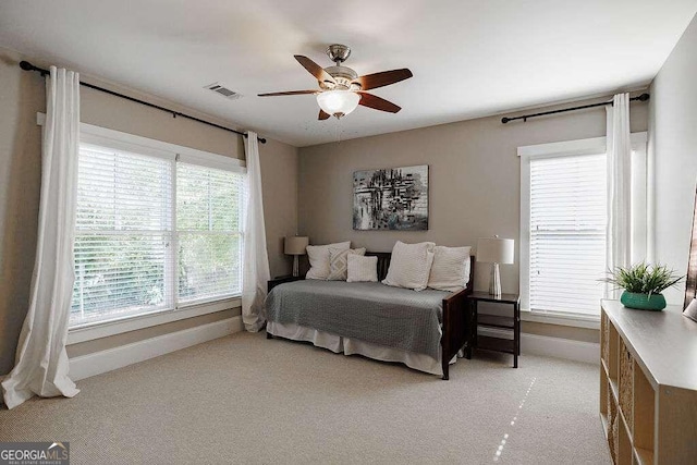 bedroom featuring ceiling fan and light colored carpet