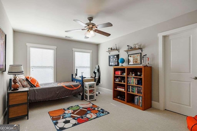 carpeted bedroom featuring ceiling fan