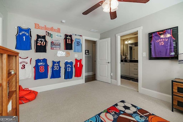 recreation room with ceiling fan and carpet floors