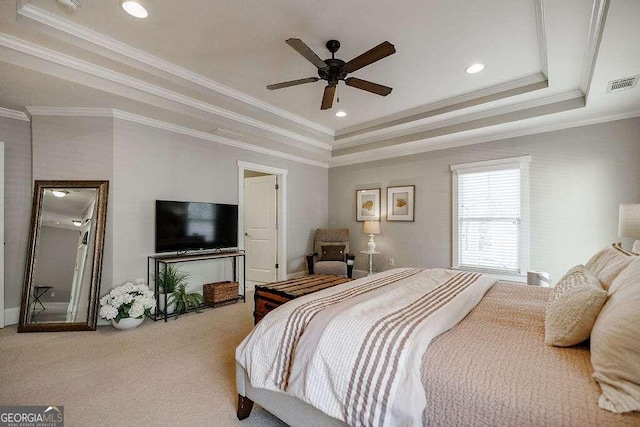 bedroom featuring carpet, a raised ceiling, ceiling fan, and ornamental molding