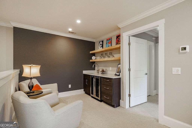 bar featuring sink, beverage cooler, crown molding, light carpet, and dark brown cabinets