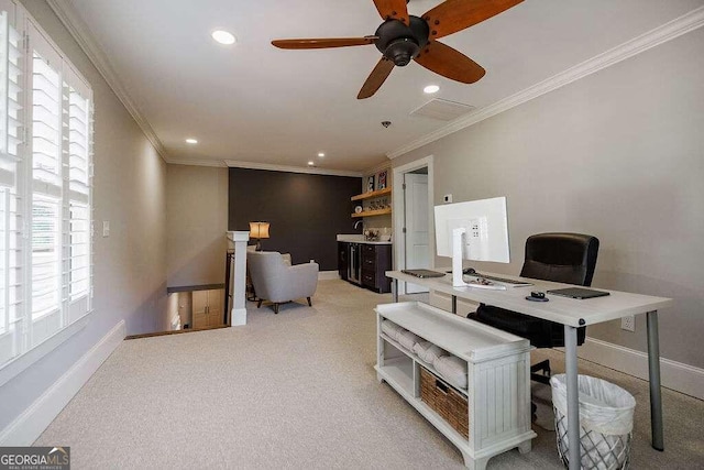 carpeted office space with ceiling fan and ornamental molding