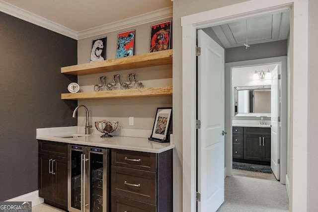 bar featuring light colored carpet, dark brown cabinetry, sink, and wine cooler