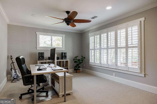 carpeted office featuring crown molding and ceiling fan