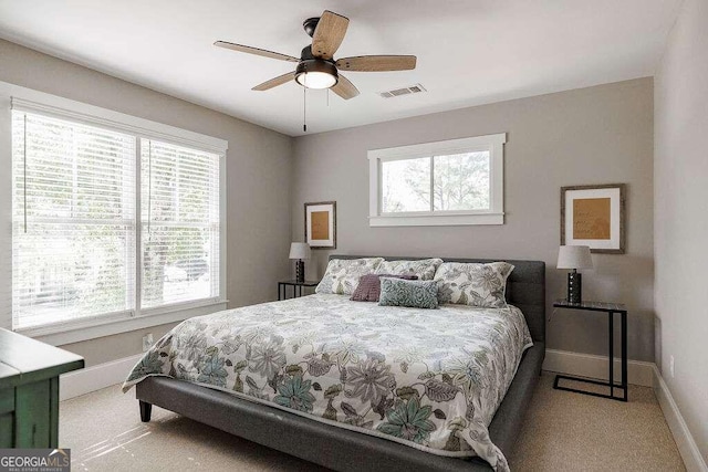 carpeted bedroom featuring ceiling fan