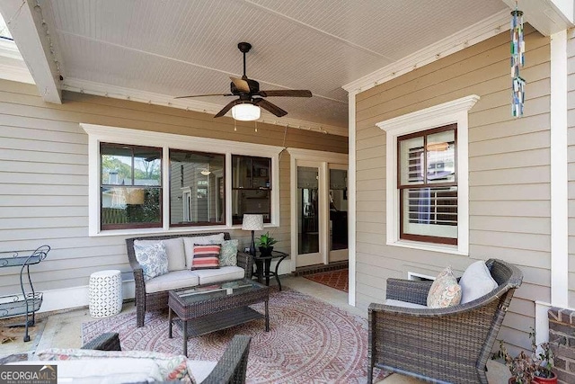 view of patio with ceiling fan and an outdoor living space