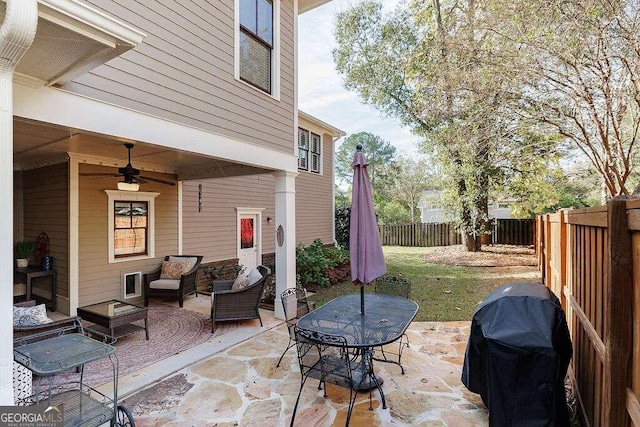 view of patio with ceiling fan and grilling area