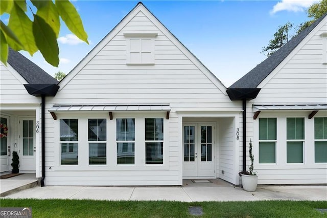 rear view of property featuring french doors and a patio