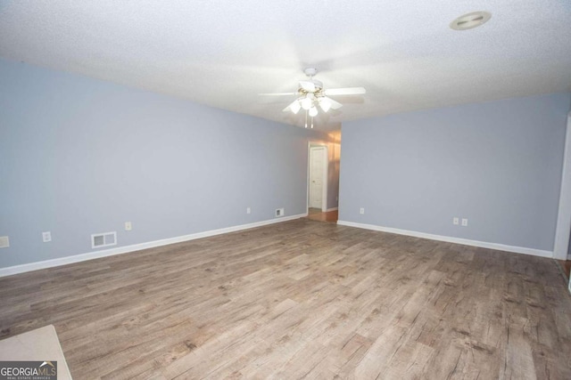 611 Bernhard Rd, Fayetteville, GA 30215 - spare room with a ceiling fan and wood finished floors