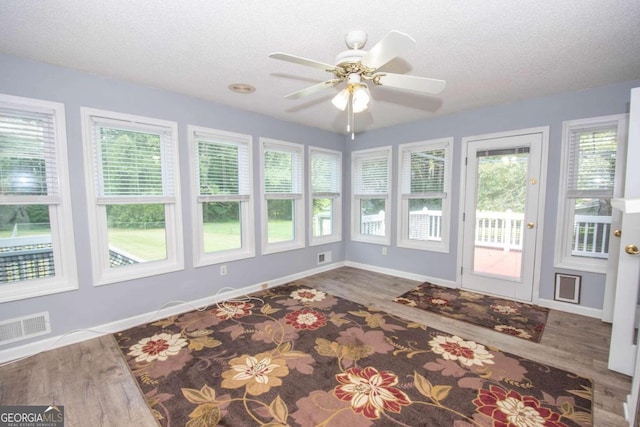 611 Bernhard Rd, Fayetteville, GA 30215 - unfurnished sunroom featuring wood finished floors and a textured ceiling