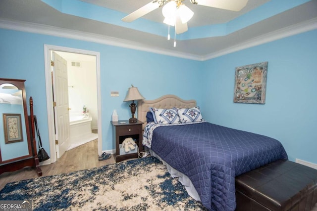 611 Bernhard Rd, Fayetteville, GA 30215 - bedroom with wood finished floors, crown molding, a ceiling fan, and a tray ceiling