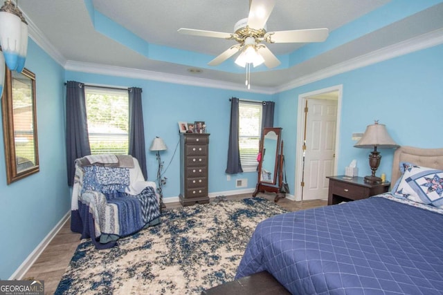 611 Bernhard Rd, Fayetteville, GA 30215 - bedroom featuring multiple windows, a raised ceiling, ornamental molding, and a ceiling fan