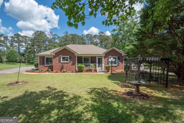 611 Bernhard Rd, Fayetteville, GA 30215 - ranch-style home featuring brick siding, a front yard, and a sunroom