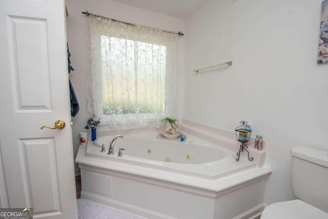 611 Bernhard Rd, Fayetteville, GA 30215 - bathroom featuring a whirlpool tub and toilet