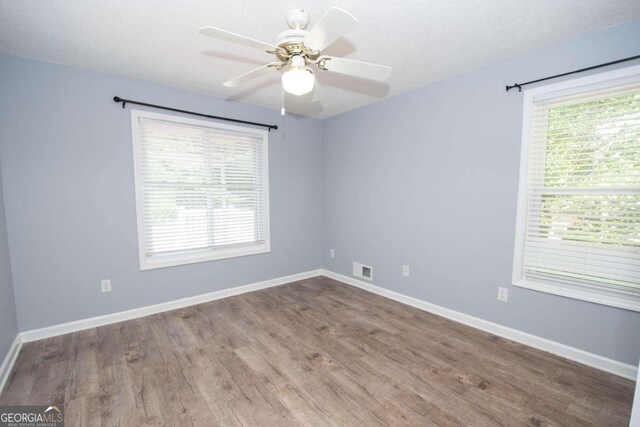 611 Bernhard Rd, Fayetteville, GA 30215 - spare room with wood finished floors and a ceiling fan