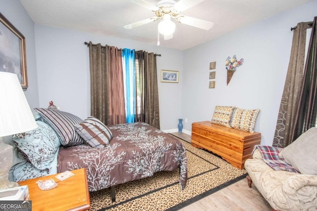 611 Bernhard Rd, Fayetteville, GA 30215 - bedroom with wood finished floors and a ceiling fan